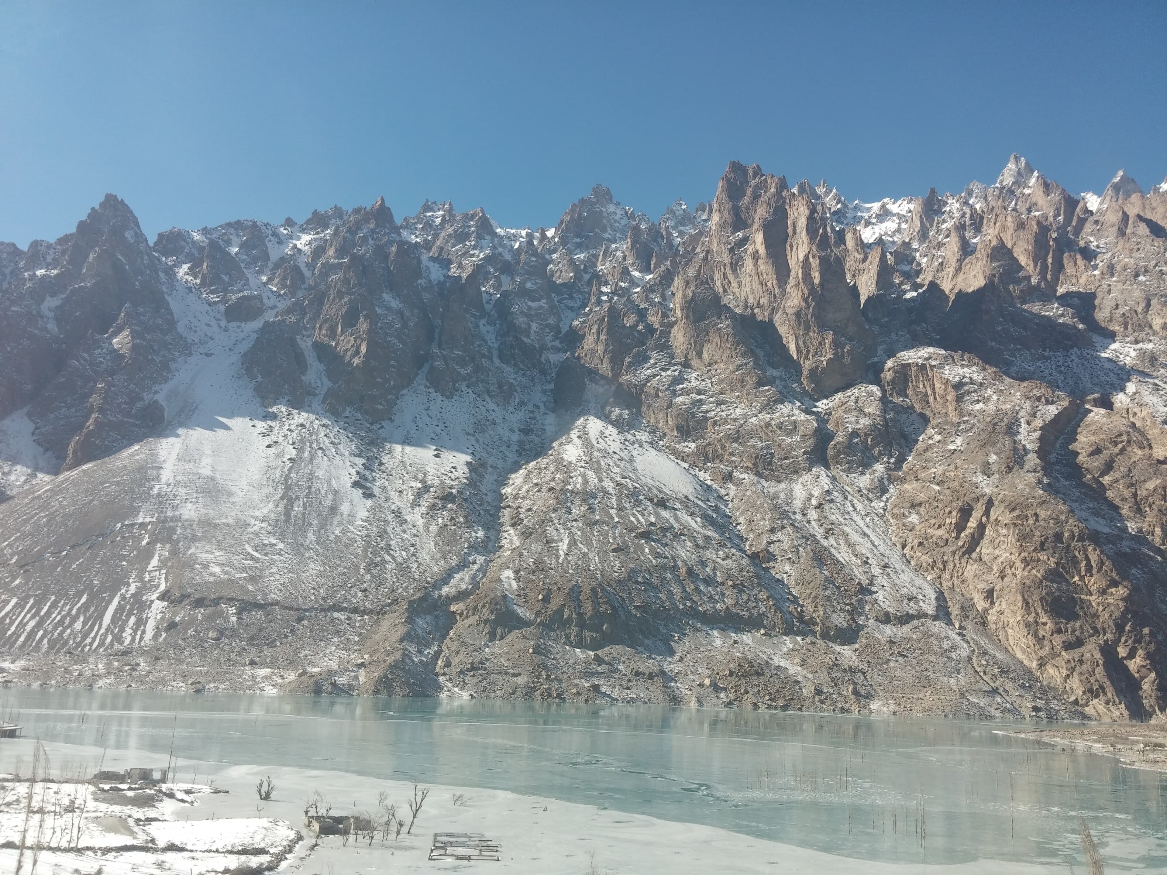 The Hunza Valley under snow in winter with Rakaposhi rising above