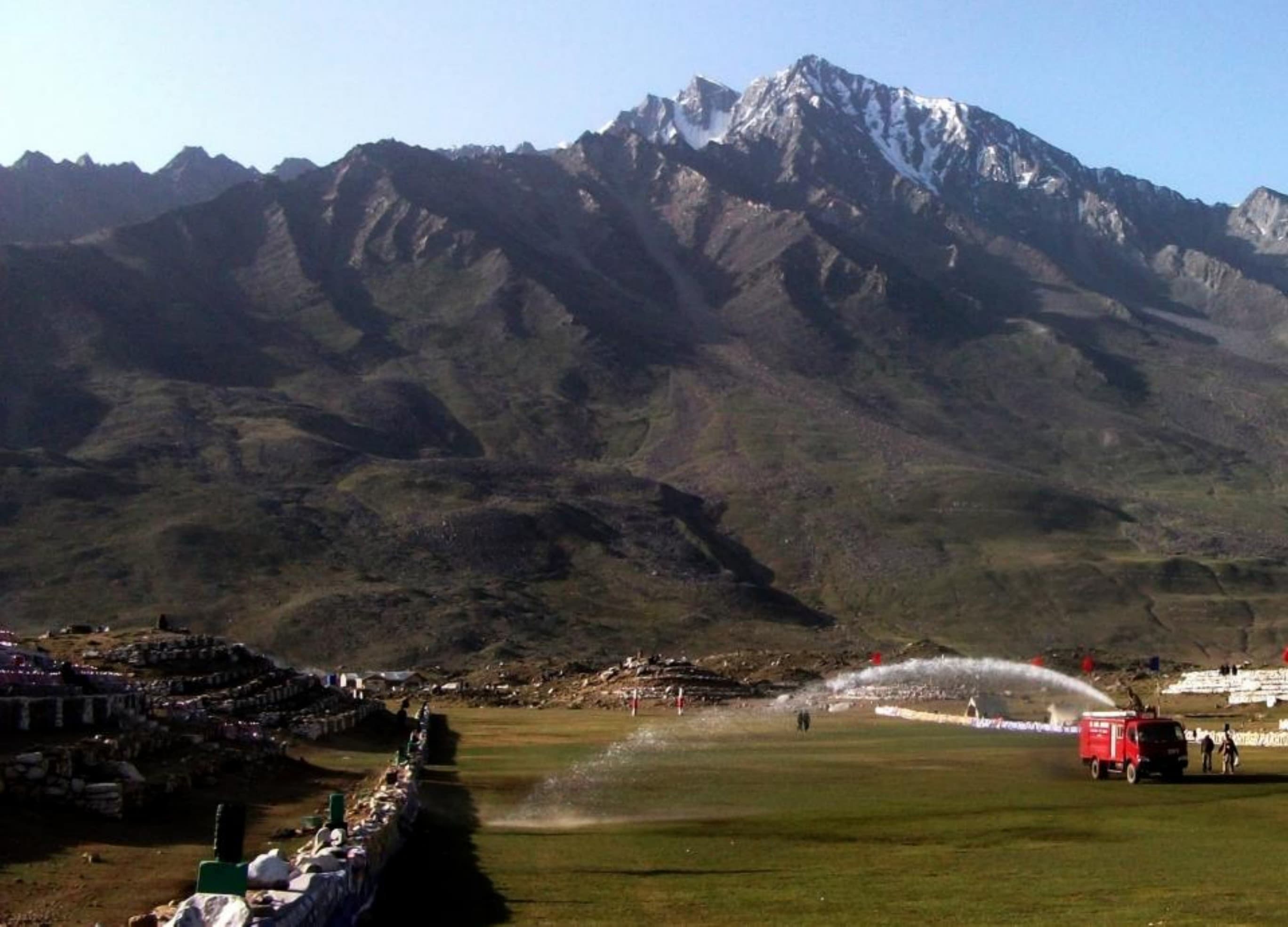 Freestyle polo at full gallop on the Shandur Pass ground during the festival